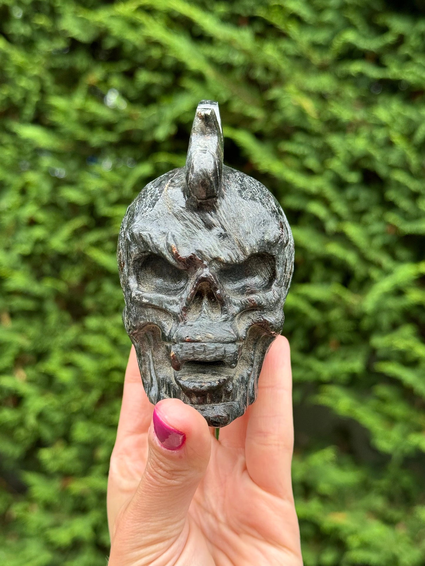 Garnet & Astrophyllite Mohawk Skull Carving (3.45")
