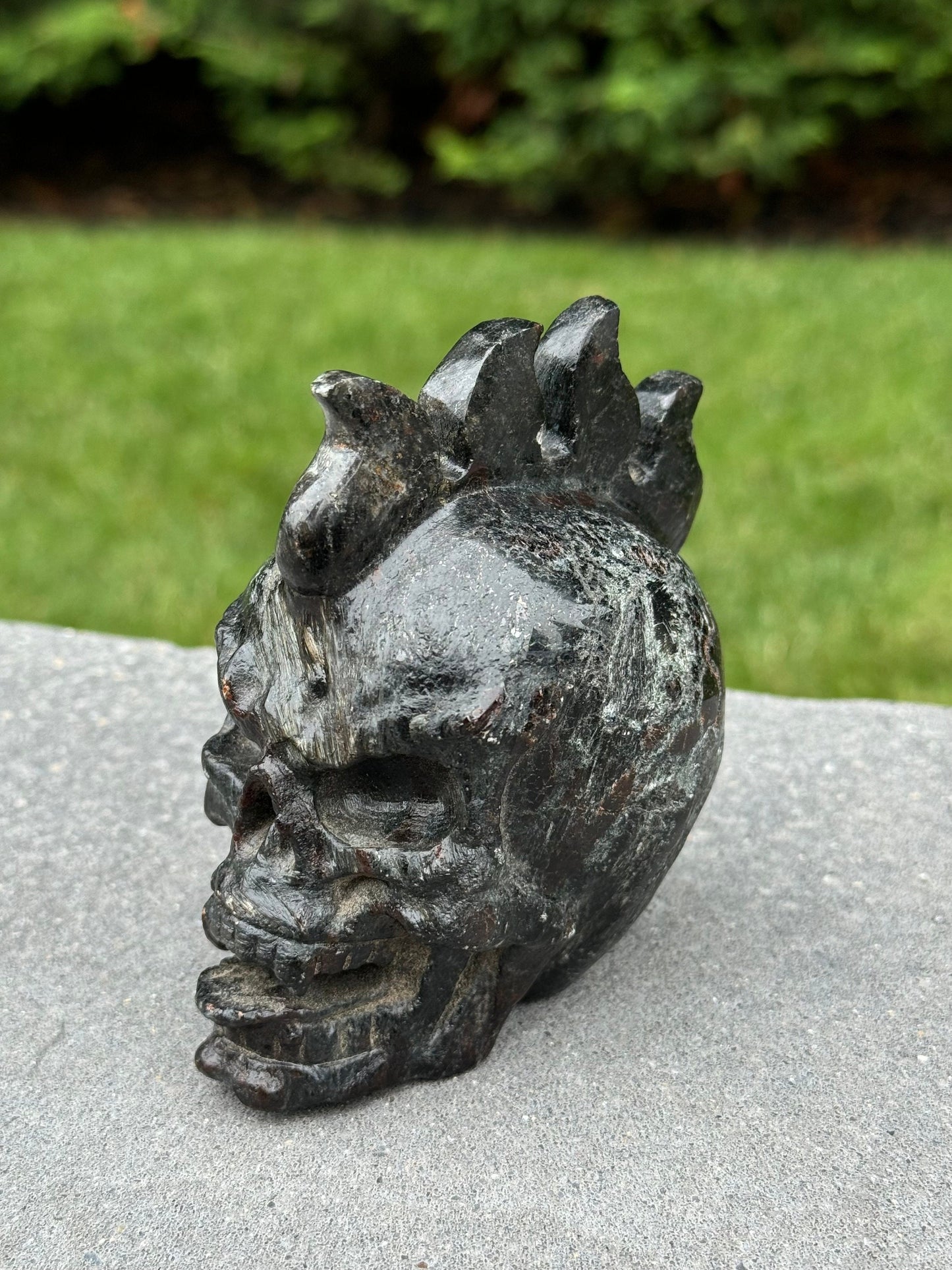 Garnet & Astrophyllite Mohawk Skull Carving (3.45")